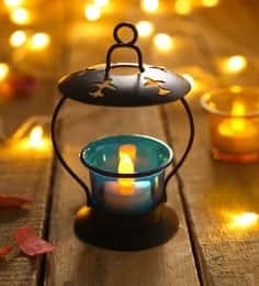 https://cdn0.desidime.com/attachments/photos/536663/medium/925046blue-metal---glass-tea-light-holder-by-anasa-blue-metal---glass-tea-light-holder-by-anasa-yh5jqt.jpg?1540619046