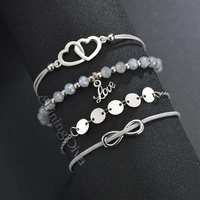 Shining Diva Fashion Set of 4 Heart Love Charm Bracelet for Women and Girls (Grey) Rs. 99 
