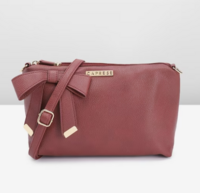 Check this outCaprese Abstract Textured Sling Bag with Bow Detail  on Myntra